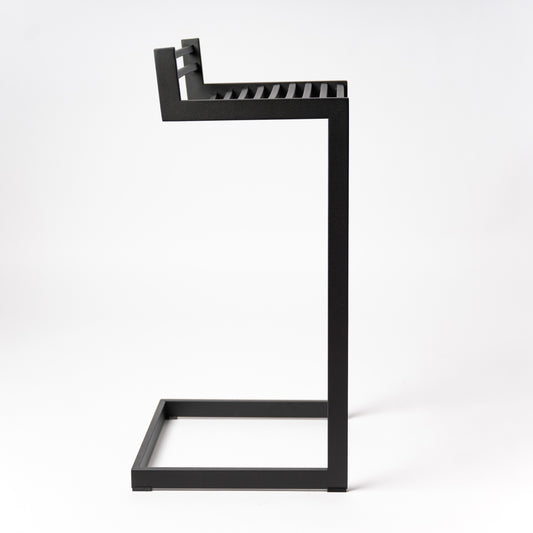 Side profile of Forma b Metalinea Black bar stool showing distinctive lowercase 'b' shape design, perfect for kitchen islands