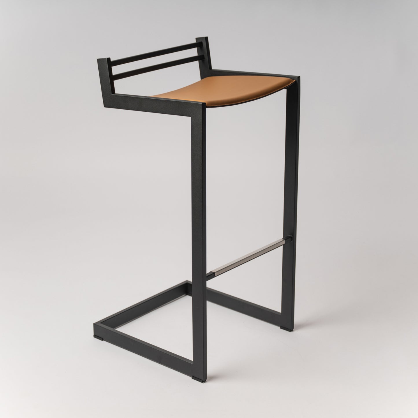 Award-winning Forma b bar tool with Black stainless steel frame and Camel Nappa leather seat - side view on neutral background