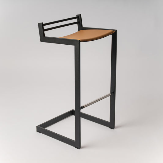 Award-winning Forma b bar tool with Black stainless steel frame and Camel Nappa leather seat - side view on neutral background