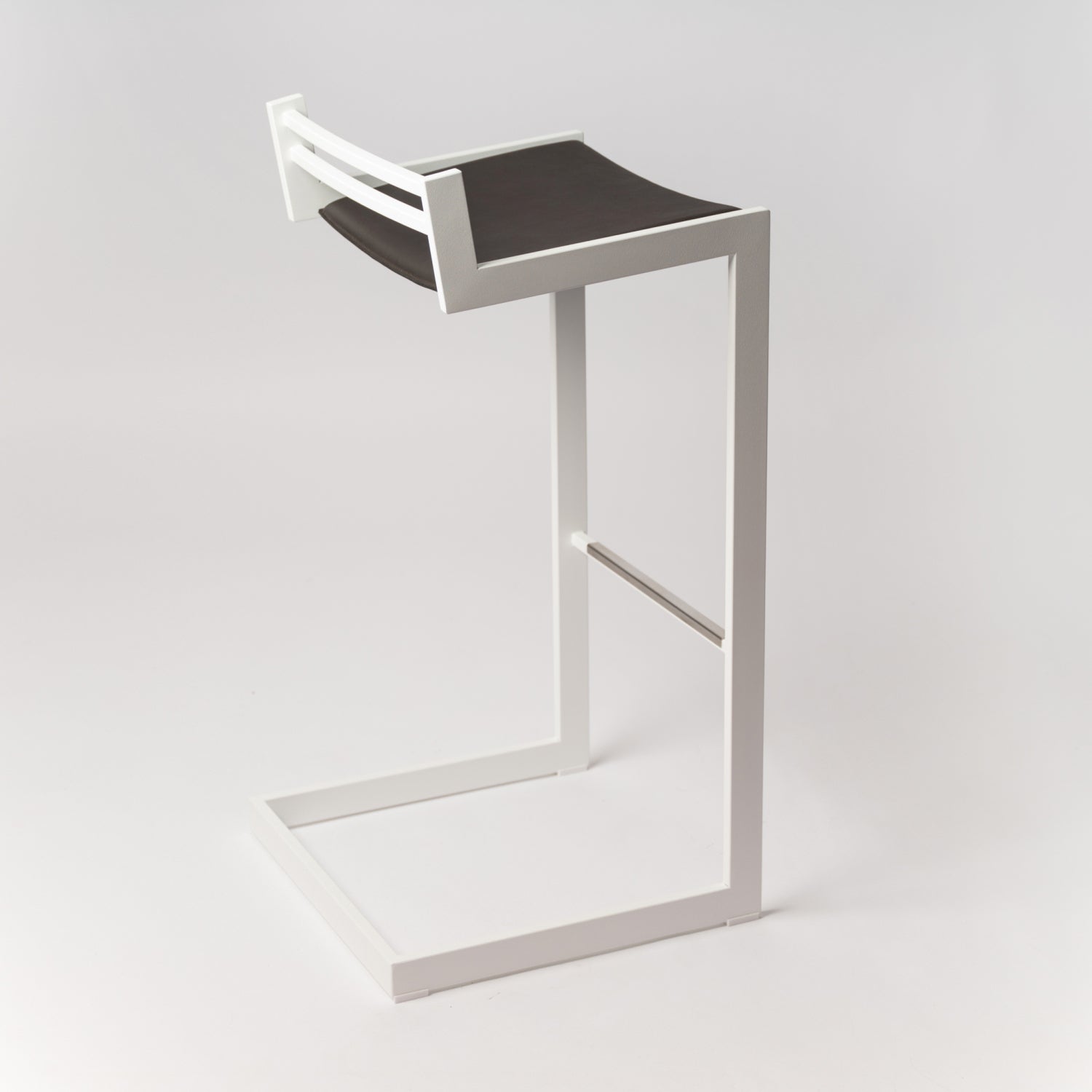 Minimalist Forma b stool - detail view of Dark Brown Nappa leather craftsmanship and White stainless steel construction, suitable for both bar and counter heights