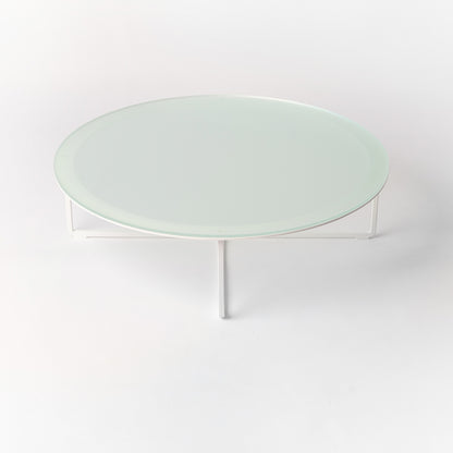 Minimalist Circo X Lounge table - side angle highlighting the architectural steel base and glass top