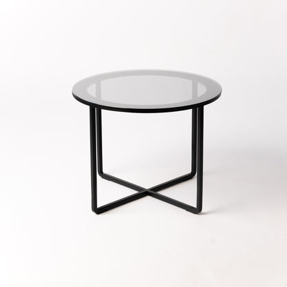 Minimalist Circo X Side Table - side angle highlighting the architectural black steel base supporting glass top