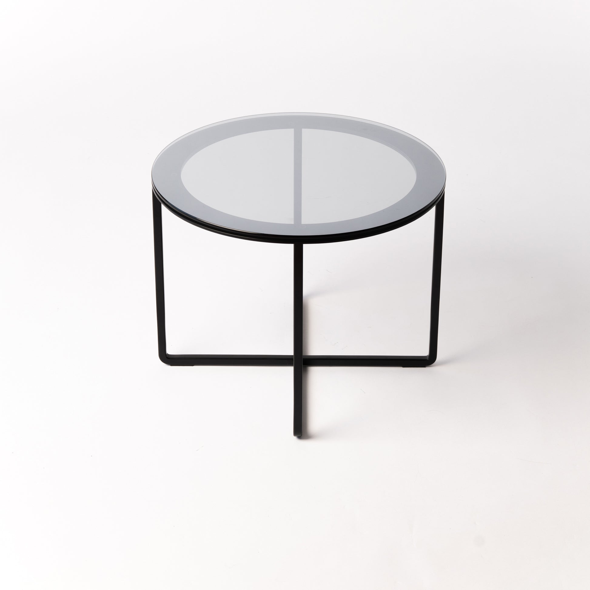 Handcrafted Circo X Side Table with glass top and black steel frame - front view showcasing minimal Scandinavian design